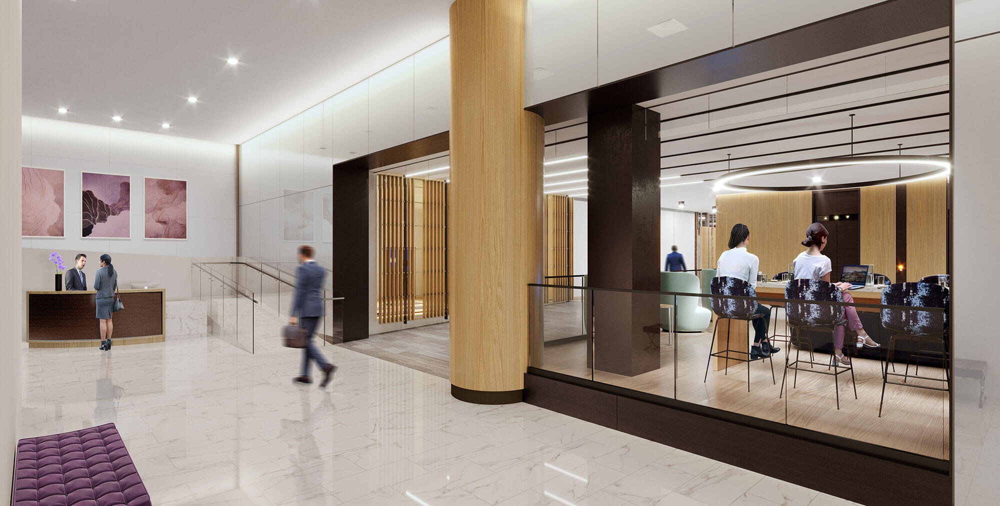 Woman talks to a male receptionist in waiting area by elevators