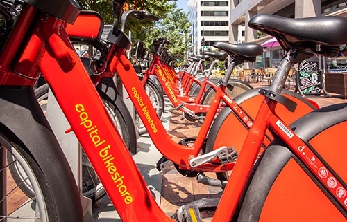Red bikes lined up at a bikeshare station