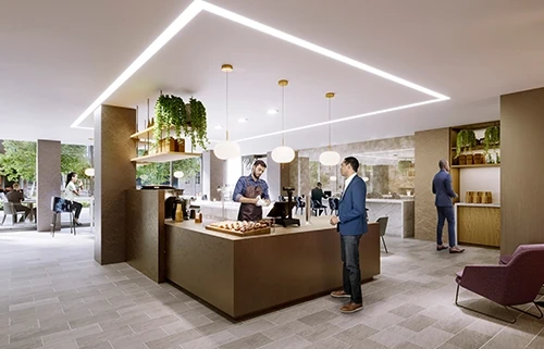 A man waits for his coffee order at a cafe