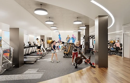 People use an indoor gym with colorful mural on back wall