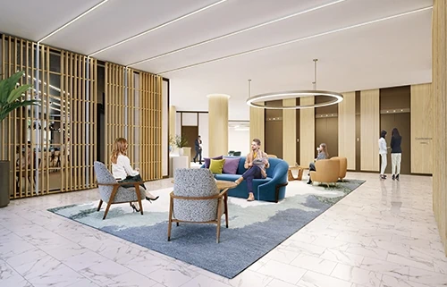 People wait in upscale lobby area with warm tones and white marble floors