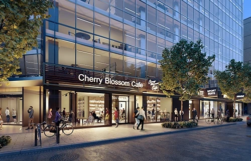 Ground floor retail stores of The Row lit up at night