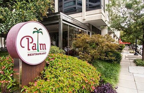 Palm Restaurant entrance with signage