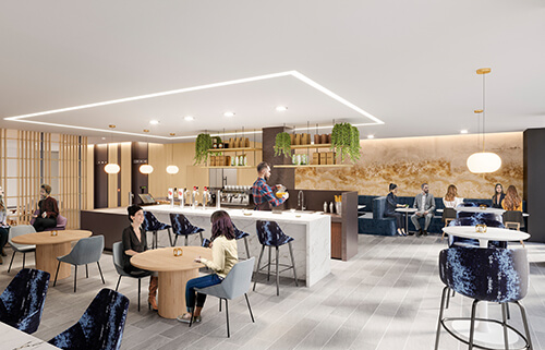 People enjoy a cafe with greenery and warm tones